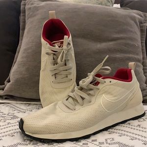Beige and read women’s Nike